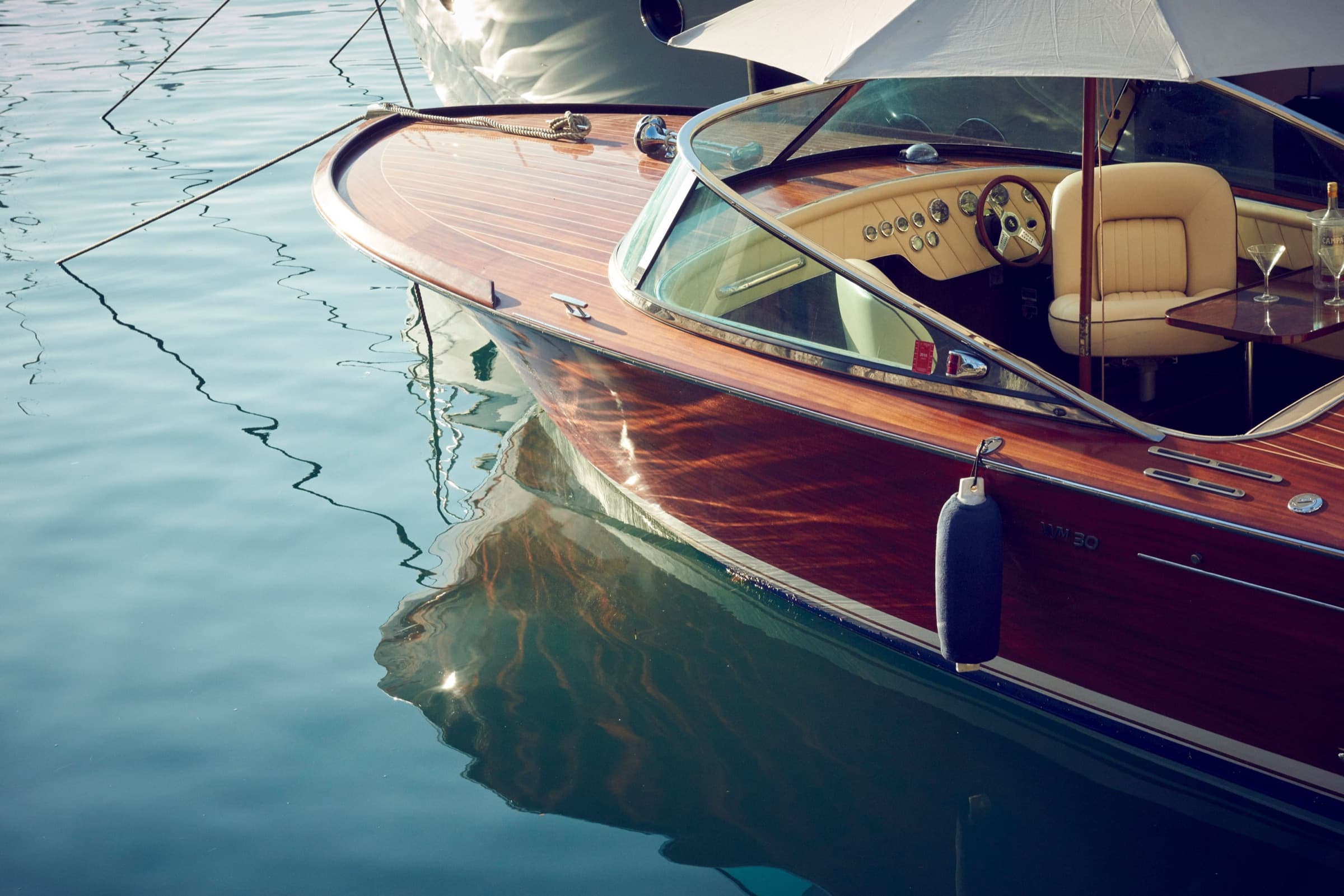Classic wooden boat at rest on still water